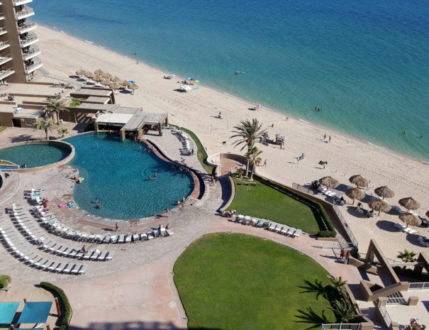 Balcony views of the swim-up bar & grille, pools and beach area!